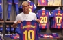 Barcelona's Spanish forward Lamine Yamal poses holding his new #10 jersey at the Camp Nou stadium's shop on July 16, 2025 in Barcelona. (Photo by Manaure Quintero / AFP)

