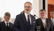 Petr Fiala, Czech Prime Minster and Leader of Czech Republic's Civic Party (ODS) and Together (SPOLU) coalition speaks at the coalition headquarters in Prague on October 4, 2025 after the parliamentary elections.  (Photo by MILAN KAMMERMAYER / AFP)