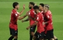 Al Rayyan's Rodrigo Moreno (second right) celebrates with teammates.