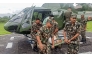 This handout photograph taken and released by Nepal's Army on October 5, 2025 shows Army personnel carrying a landslide victim evacuated by a helicoper following heavy rain-triggered landslides and floods in Nepal. (Photo by Nepalese Army / AFP) 