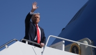 US President Donald Trump waves as he boards Air Force One en route to Naval Station Norfolk on October 5, 2025. (Photo by  Alex Wong/Getty Images/AFP)
