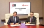 Dohatna and Vodafone Qatar officials signing the MoU. 