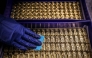 (Files) A worker polishes gold bullion bars at the ABC Refinery in Sydney on August 5, 2020. (Photo by David Gray / AFP)