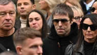 Oasis frontman Liam Gallagher (2R) arrives to attend the funeral of late British boxer Ricky Hatton on October 10, 2025. (Photo by Oli SCARFF / AFP)