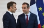 France's President Emmanuel Macron (left) with France's Minister of Armed Forces Sebastien Lecornu after delivering a speech to army leaders at l’Hôtel de Brienne in Paris on July 13, 2025. (Photo by Ludovic Marin / POOL / AFP)
