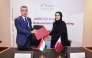 Chairperson of NHRC H E Maryam bint Abdullah Al Attiyah and Commissioner for Human Rights in Tajikistan Umed Bobozod exchanging documents after signing the agreement.