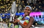 USA's Coco Gauff poses with her trophy after winning against USA's Jessica Pegula during an award ceremony for their women's singles at the Wuhan Open tennis tournament in Wuhan, Central China's Hubei province on October 12, 2025. (Photo by Adek Berry / AFP)