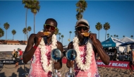 Qatar's Cherif Younousse and Ahmed Tijan celebrate after winning the Newport Beach Elite title.
