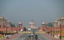 People walk past Kartavya Path near India's presidential palace (Rashtrapati Bhavan) in New Delhi on October 14, 2025. (Photo by Arun Sankar / AFP)