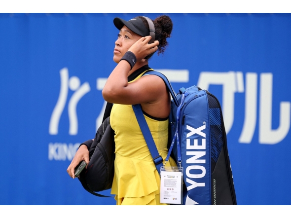 Japan's Naomi Osaka arrives to play against Netherlands' Suzan Lamens during their women's singles match at the Japan Open tennis tournament in Osaka on October 15, 2025. (Photo by PAUL MILLER / AFP)