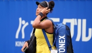 Japan's Naomi Osaka arrives to play against Netherlands' Suzan Lamens during their women's singles match at the Japan Open tennis tournament in Osaka on October 15, 2025. (Photo by PAUL MILLER / AFP)