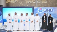 QNB officials pose for a group photo during the event.