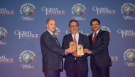 A Commercial Bank official receiving the awards during the event.