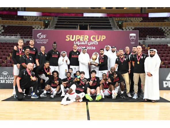 QBF President Mohammed bin Saad Al-Mughaiseeb presents the  Qatar Super Cup trophy to Al Rayyan captain.