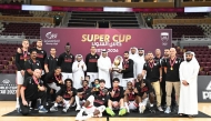 QBF President Mohammed bin Saad Al-Mughaiseeb presents the  Qatar Super Cup trophy to Al Rayyan captain.