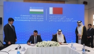 Minister of State for Foreign Trade Affairs, H E Dr. Ahmed bin Mohammed Al-Sayed, and Minister of Investment, Industry and Trade of Uzbekistan, H E Laziz Kudratov, during the signing ceremony.