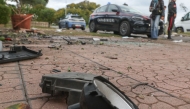Italian Carabinieri stand guard in front of the residence of Italian journalist of TV investigative television news show 'Report', Sigfrido Ranucci, after a bomb destroyed vehicles parked in front of his house in Pomezia near Rome, on 17 October 2025. Photo by Emanuele VALERI / ANSA / AFP