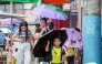 A student holds an umbrella outside a school after classes were suspended due to the tropical storm Wipha in Quezon City, the Philippines, on July 18, 2025. (Xinhua/Rouelle Umali)