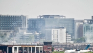 Bangladesh firefighters douse fire at the cargo terminal on October 19, 2025. Photo by Munir Uz Zaman / AFP