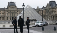 French police officers stand in front of the Louvre Museum after robbery, in Paris on October 19, 2025. (Photo by Dimitar Dilkoff / AFP) 