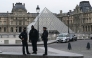 French police officers stand in front of the Louvre Museum after robbery, in Paris on October 19, 2025. (Photo by Dimitar Dilkoff / AFP) 