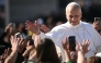Pope Leo XIV greets the crowd from the Popemobile after a mass for the canonization of seven new Saints at St Peter's square in The Vatican, on October 19, 2025. (Photo by Filippo Monteforte / AFP)
