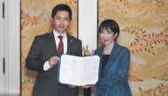 Japan's ruling Liberal Democratic Party (LDP) President Sanae Takaichi (R) and Japan Innovation Party (JIP) leader Hirofumi Yoshimura pose for the media on October 20, 2025. (Photo by Kazuhiro Nogi / AFP)