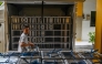 A staff member loads lunch plates on the first day of a free-meal programme at Muhammadiyah high school in Sidoarjo on January 6, 2025. Photo by Juni KRISWANTO / AFP