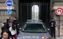 French police officers stand in front of the Louvre Museum after a robbery, in Paris on October 19, 2025. (Photo by Dimitar Dilkoff / AFP)