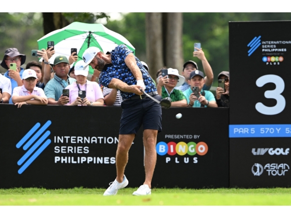 Dustin Johnson of the US tees during the International Series Philippines at Sta Elena Golf Club in Santa Rosa town, Laguna province, south of Manila on October 23, 2025. (Photo by Ted Aljibe / AFP)