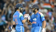 India's Rohit Sharma (R) and Virat Kohli celebrate their win at the Sydney Cricket Ground in Sydney on October 25, 2025. (Photo by Saeed Khan / AFP) 