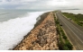 Storm surge crashes into the seawall that protects Palisadoes Strip, the route to Norman Manley International Airport, before the arrival of Hurricane Melissa, in Kingston, Jamaica, on October 25, 2025. Photo by Ricardo Makyn / AFP
