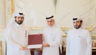 Officials honouring owner of Al Hazm Mall Mohammed Abdul Karim Al-Emadi.