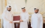 Officials honouring owner of Al Hazm Mall Mohammed Abdul Karim Al-Emadi.