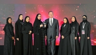 QNB officials receiving the award during the 11th Middle East Enterprise AI & Analytics Summit.