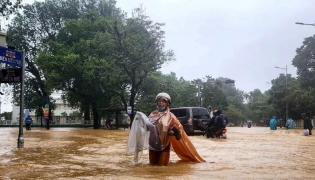 Thousands in Vietnam evacuated after record rain triggers floods