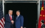 US President Donald Trump (L) and China's President Xi Jinping shake hands as they leave after their talks at the Gimhae Air Base on October 30, 2025. (Photo by Andrew Caballero-Reynolds / AFP)
 
