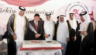Speaker of the Shura Council H E Hassan bin Abdullah Al-Ghanim, Minister of Awqaf and Islamic Affairs H E Ghanem bin Shaheen bin Ghanem Al Ghanim, Minister of Labour H E Ali bin Saeed bin Samikh Al-Marri, Minister of State for Foreign Affairs H E Sultan bin Saad bin Sultan Al-Muraikhi, Minister of State and President of the Qatar National Library H E Dr. Hamad Al-Kawari, and Ambassador of Turkiye to Qatar H E Dr. Mustafa Goksu cutting the cake to celebrate the Republic Day of Turkiye, in Doha yesterday.