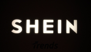 A picture shows the logo Shein during the Urban Ritual fashion show Fall-Winter 2025/26 organized by Chinese fashion giant Shein in Milan, on October 16, 2025. Photo by Piero CRUCIATTI / AFP