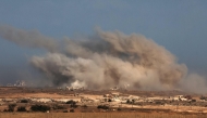 This picture taken from a position at Israel's border with the Gaza Strip shows smoke billowing during an Israeli strike on the besieged Palestinian territory on October 30, 2025. (Photo by Jack GUEZ / AFP)