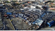 An aerial view of destroyed buildings following the passage of Hurricane Melissa, in Black River, St. Elizabeth, Jamaica on October 29, 2025. (Photo by Ricardo Makyn / AFP)

