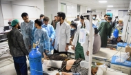 Afghan medical personnel treat wounded men at a hospital in the aftermath of an earthquake, that struck overnight in Mazar-i-Sharif on November 3, 2025. Photo by Atif Aryan / AFP
