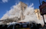 Dust rises due to a second collapse of part of the medieval tower 