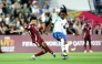 Qatar's Adam Friakh (left) and Italy's Destiny Elimoghale vie for the ball possession. 