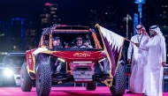 QMMF President Abdulrahman Al-Mannai flags off Nasser Saleh Al-Attiyah at ‘Way to the World Cup’ landmark on Doha Corniche. QMMF General Secretary Abdulrazzaq Al-Kuwari is also present.