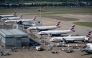 British Airways jets are seen parked on the tarmac at Heathrow Airport on June 13, 2021, in west London. Photo by Brendan Smialowski / AFP