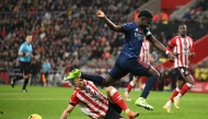 Sunderland's Swiss midfielder #34 Granit Xhaka (L) tackles Arsenal's English midfielder #07 Bukayo Saka (R) during the English Premier League football match between Sunderland and Arsenal at The Stadium of Light in Sunderland in north east England on November 8, 2025. (Photo by Oli SCARFF / AFP)
