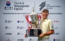 This handout photograph from the Asian Tour taken and received on November 9, 2025 shows Japan's Yosuke Asaji posing with the trophy after the 2025 Moutai Singapore Open golf tournament. (Photo by Graham Uden / Asian Tour / AFP) 