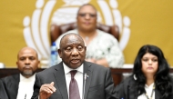 South African President Cyril Ramaphosa speaks during a question-and-answer session in the National Assembly in Cape Town, South Africa. Photo by Xabiso Mkhabela/Xinhua