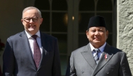 Australia's Prime Minister Anthony Albanese (L) greets Indonesia's President Prabowo Subianto at Kirribilli House in Sydney on November 12, 2025. (Photo by Hollie Adams / POOL / AFP)